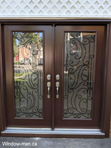 Double entry insulated front exterior doors. Santa Ana wrought iron glass design. Chestnut Brown